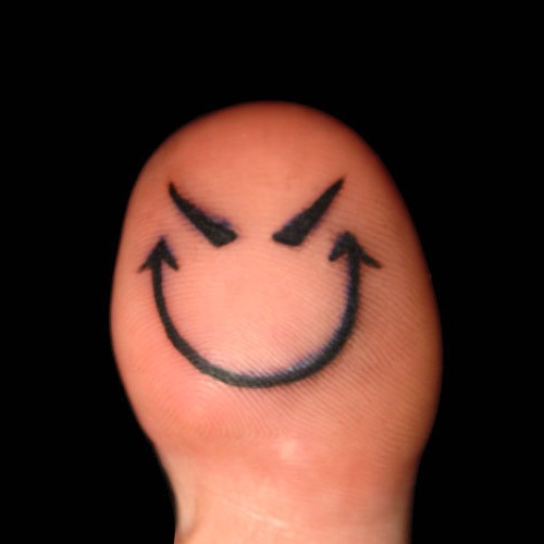 In many evil smiley tattoos
